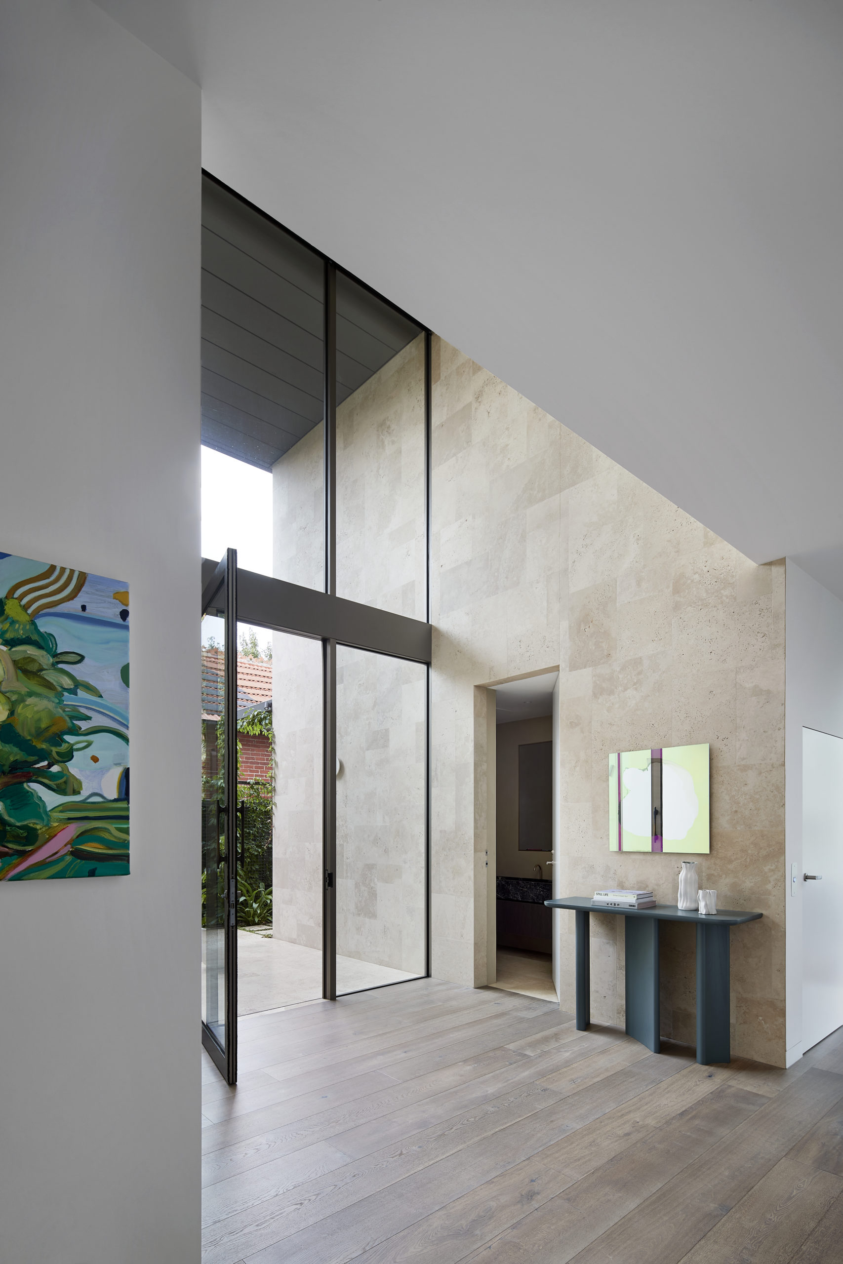 The beautiful entrance of Evergreen House by Robson Rak featuring Otto XIII Smoked engineered European oak flooring