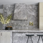 The beautiful kitchen of Evergreen House by Robson Rak featuring Otto XIII Smoked engineered European oak flooring and stormy-grey stone