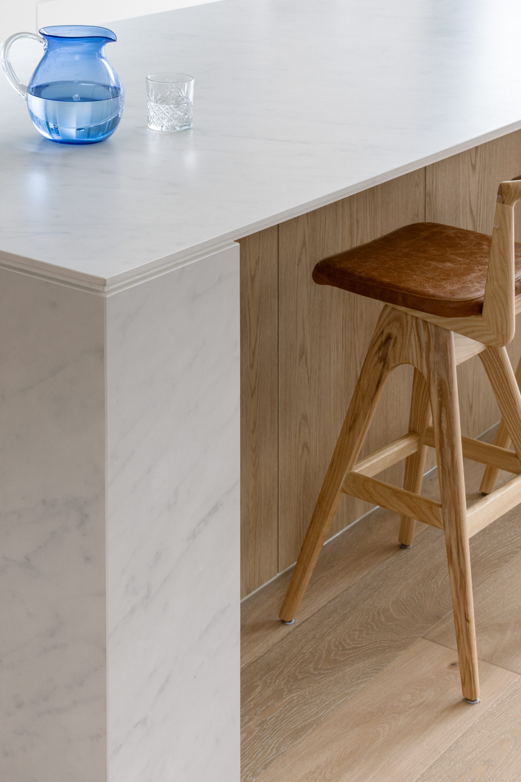 Close-up of a kitchen island, featuring oak effect laminate joinery from George Fethers' Cellupal range in the colour Eik.